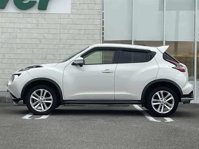 日産 ジューク 15RX Vセレクション 宮崎県 2016(平28)年 10.7万km ブリリアントホワイトパール 純正SDナビ/（CD/AM/FM/BT/AUX)/フルセグTV/バックカメラ/横滑り防止機能/アイドリングストップ/レーンキープアシスト/衝突防止機能/社外エアロ/ETC