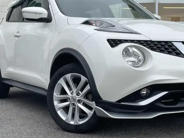 日産 ジューク 15RX Vセレクション 宮崎県 2016(平28)年 10.7万km ブリリアントホワイトパール 純正SDナビ/（CD/AM/FM/BT/AUX)/フルセグTV/バックカメラ/横滑り防止機能/アイドリングストップ/レーンキープアシスト/衝突防止機能/社外エアロ/ETC