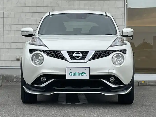 日産 ジューク 15RX Vセレクション 宮崎県 2016(平28)年 10.7万km ブリリアントホワイトパール 純正SDナビ/（CD/AM/FM/BT/AUX)/フルセグTV/バックカメラ/横滑り防止機能/アイドリングストップ/レーンキープアシスト/衝突防止機能/社外エアロ/ETC