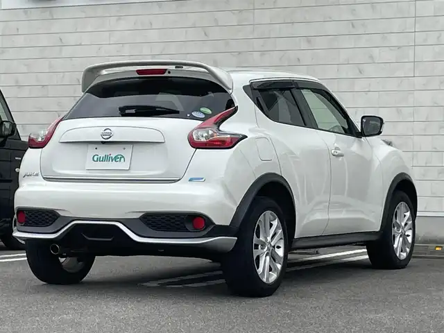日産 ジューク 15RX Vセレクション 宮崎県 2016(平28)年 10.7万km ブリリアントホワイトパール 純正SDナビ/（CD/AM/FM/BT/AUX)/フルセグTV/バックカメラ/横滑り防止機能/アイドリングストップ/レーンキープアシスト/衝突防止機能/社外エアロ/ETC