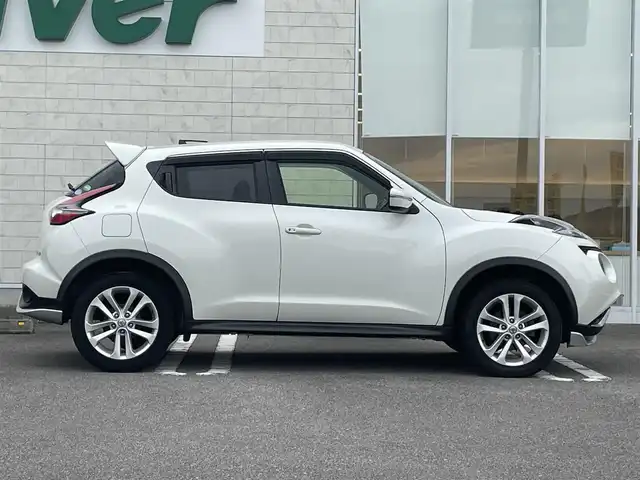 日産 ジューク 15RX Vセレクション 宮崎県 2016(平28)年 10.7万km ブリリアントホワイトパール 純正SDナビ/（CD/AM/FM/BT/AUX)/フルセグTV/バックカメラ/横滑り防止機能/アイドリングストップ/レーンキープアシスト/衝突防止機能/社外エアロ/ETC