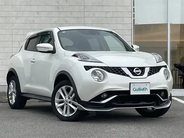 日産 ジューク 15RX Vセレクション 宮崎県 2016(平28)年 10.7万km ブリリアントホワイトパール 純正SDナビ/（CD/AM/FM/BT/AUX)/フルセグTV/バックカメラ/横滑り防止機能/アイドリングストップ/レーンキープアシスト/衝突防止機能/社外エアロ/ETC
