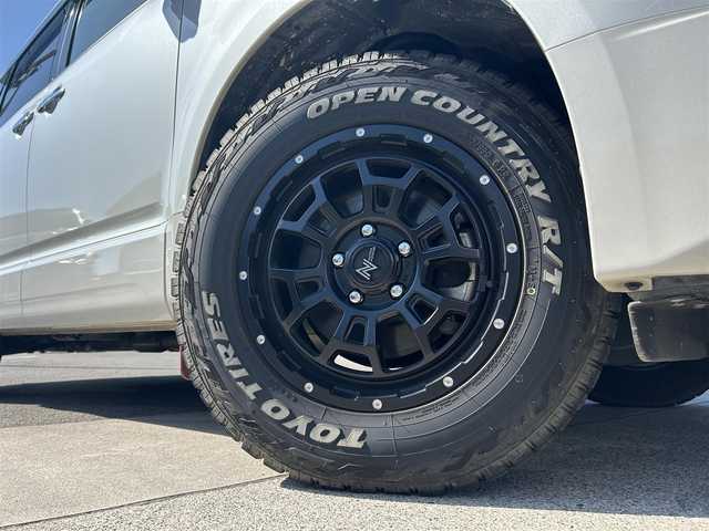 三菱 デリカＤ：５ P 愛媛県 2021(令3)年 3.9万km ポーラホワイト 禁煙車/ALPINE製11インチナビ/CD/DVD/フルセグTV/Bluetooth/HDMI/全方位カメラ/バックカメラ/ブラインドスポットモニター/ルームミラー式レーダー探知機(ASSURA/AR-5)/前後ドライブレコーダー(SDカードなし)/ETC/車内天井ルーフキャリア/衝突被害軽減システム/横滑り防止装置/レーンキープアシスト/レーダークルーズコントロール/LEDヘッドライト/フォグランプ/オートライト/オートマチックハイビーム/前席シートヒーター/運転席パワーシート/ステアリングヒーター/パドルシフト/オートステップ(左)/両側パワースライドドア/パワーバックドア/エンジンスタートボタン/スマートキー/純正フロアマット/NITRO POWER製16インチアルミホイール