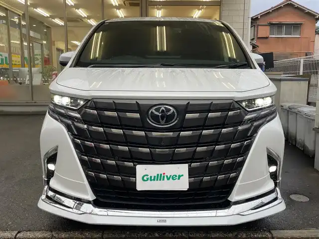トヨタ アルファードハイブリット Z 愛知県 2024(令6)年 1.1万km プラチナホワイトパールマイカ /当店買取/法人1オナ/モデリスタ20AW/純正アルミ積込//モデリスタエアロブルーイルミネーション付//モデリスタマフラー//モデリスタマルチカラーインテリアイルミ//パノラミックビューモニター//デジタルインナーミラー/ユニバーサルステップ//純正メーカーナビ/純正12.3型有機EL後席モニター//トヨタチームメイト/TSS/ETC2.0/Pソナー/Pアシスト//パワーゲート//フルセグTV/Carplay/Bluetooth/HDMI/typeC//サンルーフ/本革シート/Pシート/シートヒーター//シートベンチレーション/ステアリングヒーター//エアロドアバイザー//LEDヘッド/Aライト/AHB//ISOFIX/純正フロアマット/AC100V//社外セキュリティVIPER/社外インテリアパネル//保証書/取説/後席リモコン
