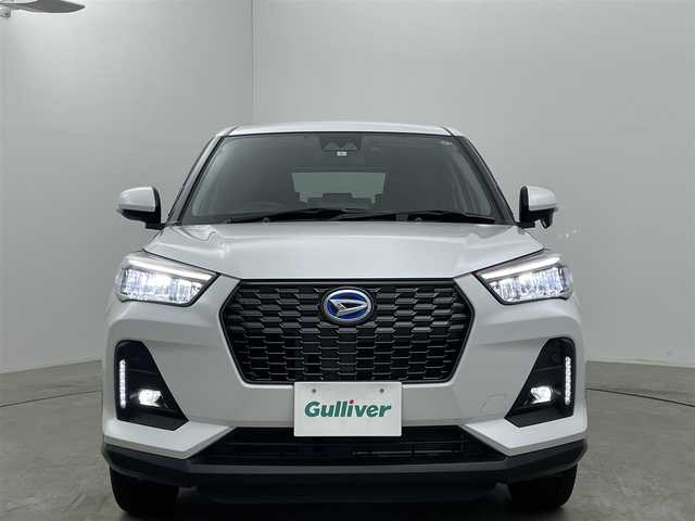 ダイハツ ロッキー プレミアム G HEV 岡山県 2023(令5)年 1.7万km シャイニングホワイトパール 純正9インチナビ/レーダークルーズコントロール/ビルトインＥＴＣ２．０/コーナーセンサー/レーンキープアシスト/シートヒーター/バックカメラ/ＬＥＤヘッドライト/ステアリングスイッチ/踏み間違い防止/オートハイビーム/オートライト/スペアキー