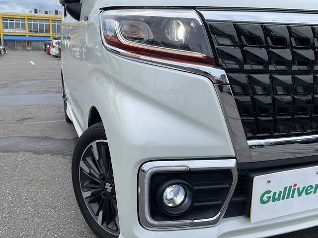 スズキ スペーシア カスタム HYBRID XS ターボ 道北・旭川 2022(令4)年 2.4万km ピュアホワイトパール/ブラック2トーン ・4WD/・禁煙車/・社外8型ナビ　AVIC-CL912/BT/フルセグ/DVD/AUX/HDMI/・両側パワースライドドア/・前席シートヒーター/・全方位モニター/・前後ドライブレコーダー/・エンジンスターター////スズキセーフティサポート////・デュアルカメラブレーキサポート/・誤発進抑制機能/・車線逸脱警報/・ふらつき警報/・先行車発進お知らせ機能/・ハイビームアシスト/・アダプティブクルーズコントロール/・標識認識機能/・後退時ブレーキサポート/・後方誤発進抑制機能/・リアパーキングセンサー/・純正ドアバイザー/・電動格納ミラー/・セカンドテーブル/・保証書/・取扱説明書