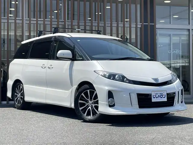 トヨタ エスティマ アエラス 鳥取県 2015(平27)年 11.6万km ホワイトパールクリスタルシャイン (株)IDOMが運営する【じしゃロン鳥取店】の自社ローン専用車両になります。こちらは現金またはオートローンご利用時の価格です。自社ローンご希望の方は別途その旨お申付け下さい/４WD/社外ナビ（AVIC-HRZ0096）/・CD/DVD/・ワンセグTV/バックカメラ/ビルトインETC/フリップダウンモニター/両側パワースライドドア/純正アルミホイール/プッシュスタート/スマートキー/クルーズコントロール/ルーフラック/電動格納ミラー/ドアバイザー/フォグランプ