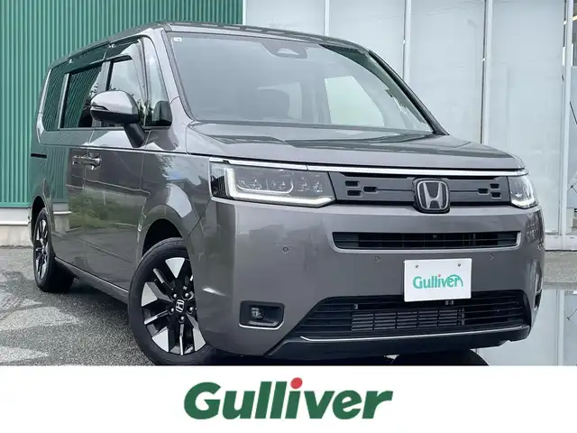 ホンダ ステップワゴン 福岡県 2022(令4)年 1.9万km スーパープラチナグレーメタリック プッシュスタートボタン/スマートキー/クルーズコントロール/純正ナビ/Bluetoothオーディオ/全方位カメラ/フルセグTV/ETC/前方ドライブレコーダー/両側パワースライドドア/純正アルミホイール/SOSコール