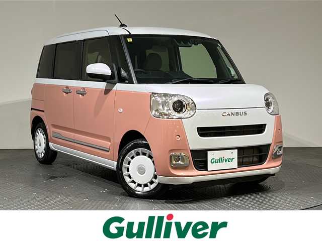 ダイハツ ムーヴ キャンバス ストライプス G 愛媛県 2022(令4)年 0.7万km シャイニングホワイトパール/アプリコットピンクメタリック ・スマートアシスト/・レーンアシスト/・純正メモリーナビ/・Bluetooth/フルセグテレビ/DVD/・バックカメラ/・ドライブレコーダー/・ETC/・両側パワースライドドア/・LEDヘッドライト/・シートヒーター/・スマートキー