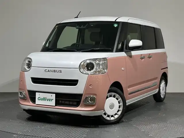 ダイハツ ムーヴ キャンバス ストライプス G 愛媛県 2022(令4)年 0.7万km シャイニングホワイトパール/アプリコットピンクメタリック ・スマートアシスト/・レーンアシスト/・純正メモリーナビ/・Bluetooth/フルセグテレビ/DVD/・バックカメラ/・ドライブレコーダー/・ETC/・両側パワースライドドア/・LEDヘッドライト/・シートヒーター/・スマートキー