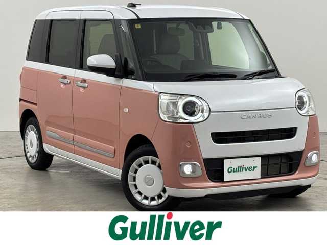ダイハツ ムーヴ キャンバス ストライプス G 福岡県 2022(令4)年 0.7万km シャイニングホワイトパール/アプリコットピンクメタリック 純正ナビ／フルセグＴＶ　/バックカメラ　/ホッとカップホルダー　/ＥＴＣ　/ドラレコ　/コーナーセンサー　/スマートアシスト　/衝突軽減ブレーキ　/レーンキープ　/アイドリングストップ　/両側電動スライドドア　/シートヒーター　/ＬＥＤヘッドライト
