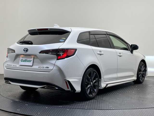 トヨタ カローラツーリング ハイブリッド ダブルバイビー 愛媛県 2020(令2)年 1.3万km ホワイトパールクリスタルシャイン 純正ナビ/Ｂｌｕｅｔｏｏｔｈ／ＵＳＢ/バックカメラ/衝突軽減ブレーキ/レーダークルーズコントロール/ＥＴＣ２．０/全方位ドライブレコーダー/モデリスタエアロ/前後コーナーセンサー/レーンキープアシスト/オートマチックハイビーム/LEDヘッドライト