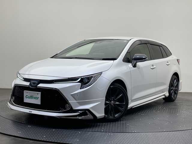 トヨタ カローラツーリング ハイブリッド ダブルバイビー 愛媛県 2020(令2)年 1.3万km ホワイトパールクリスタルシャイン 純正ナビ/Ｂｌｕｅｔｏｏｔｈ／ＵＳＢ/バックカメラ/衝突軽減ブレーキ/レーダークルーズコントロール/ＥＴＣ２．０/全方位ドライブレコーダー/モデリスタエアロ/前後コーナーセンサー/レーンキープアシスト/オートマチックハイビーム/LEDヘッドライト