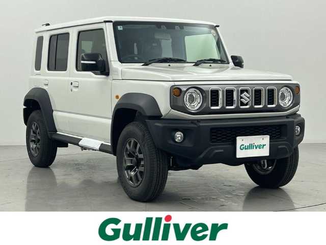 スズキ ジムニー ノマド FC 熊本県 2025(令7)年 0.1万km アークティックホワイトパール ワンオーナー　/禁煙車　/４WD/レーダークルーズコントロール　/前席シートヒーター　/衝突軽減ブレーキ　/レーンキープアシスト　/横滑り防止　/アイドリングストップ　/パーキングアシスト/ダウンヒルアシスト/オートライト/オートマチックハイビーム/LEDヘッドライト/フォグライト/スマートキー/プッシュスタート/スペアキー１本　/保証書　/取扱説明書