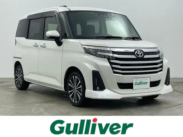 トヨタ ルーミー カスタムG－T 岡山県 2022(令4)年 3.2万km パールホワイトⅢ 純正９インチナビ/【Bluetooth/フルセグTV/CD】/衝突軽減ブレーキシステム/両側電動スライドドア/追従型クルーズコントロール/全方位カメラ/ビルトインＥＴＣ/ＬＥＤヘッドライト/オートハイビーム/LEDフォグランプ/社外ドライブレコーダー（前後）/コーナーセンサー（前後）/踏み間違い防止/オートブレーキホールド/ISOFIX/後席サンシェイド/ステアリングスイッチ/シートリフター/ウインカーミラー/ドアバイザー