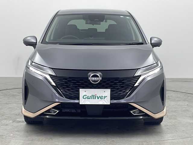 日産 オーラ G レザーエディション 三重県 2022(令4)年 1.1万km ダークメタルグレー 禁煙車/エマージェンシーブレーキ/純正SDナビ/BT/フルセグTV/全方位カメラ/デジタルインナーミラー/クリアランスソナー/ブラインドスポットモニター/レザーシート/オートブレーキホールド/純正ドライブレコーダー/オートハイビーム/純正17インチアルミホイール/スマートキー