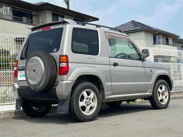 三菱 パジェロ ミニ V 静岡県 2001(平13)年 13.7万km シンフォニックシルバー ５速ＭＴ/４ＷＤ/純正アルミホイール/ルーフレール/純正フロアマット/背面タイヤ/ダブルエアバック/リモコンキー/パワーステアリング/パワーウィンドウ/ＡＢＳ