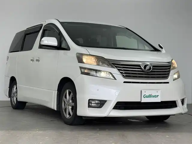 トヨタ ヴェルファイア 2．4Z プラチナセレクション 愛知県 2009(平21)年 15万km ホワイトパールクリスタルシャイン トヨタ純正ディーラーオプション7インチHDDナビ/ワンセグTV/Bluetooth対応/ステアリングリモコン/プッシュスタート/ビルトインETC/ドライブレコーダー/3列シート/キャプテンシート/ウォークスルー/両側パワースライドドア/社外16インチアルミホイール/16インチスタッドレスタイヤ/前後コーナーセンサー/サイドエアバック/カーテンエアバック/取扱説明書/保証書/スマートキー/スペアキー