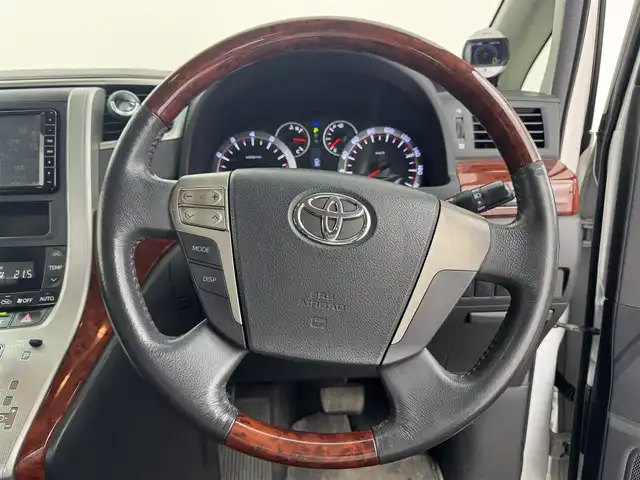 トヨタ ヴェルファイア 2．4Z プラチナセレクション 愛知県 2009(平21)年 15万km ホワイトパールクリスタルシャイン トヨタ純正ディーラーオプション7インチHDDナビ/ワンセグTV/Bluetooth対応/ステアリングリモコン/プッシュスタート/ビルトインETC/ドライブレコーダー/3列シート/キャプテンシート/ウォークスルー/両側パワースライドドア/社外16インチアルミホイール/16インチスタッドレスタイヤ/前後コーナーセンサー/サイドエアバック/カーテンエアバック/取扱説明書/保証書/スマートキー/スペアキー