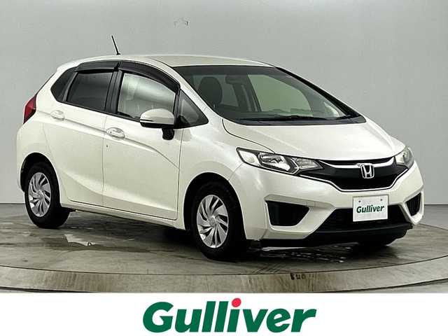 ホンダ フィット 13G Fパッケージ 愛知県 2016(平28)年 6.4万km プレミアムホワイトパールⅡ 禁煙車/純正7インチナビ/(CD/DVD/AM/FM/Bluetooth/ワンセグTV）/バックカメラ/ETC/前方ドライブレコーダー/スマートキー/プッシュスタート/純正フロアマット/横滑り防止装置/ステアリングスイッチ/オートエアコン/ドアバイザー