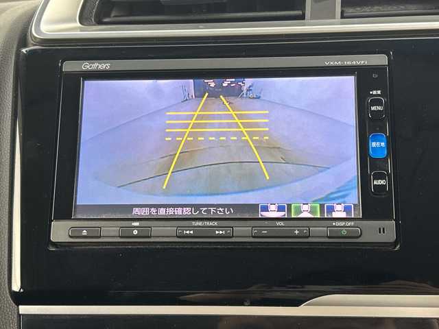 ホンダ フィット 13G Fパッケージ 愛知県 2016(平28)年 6.4万km プレミアムホワイトパールⅡ 禁煙車/純正7インチナビ/(CD/DVD/AM/FM/Bluetooth/ワンセグTV）/バックカメラ/ETC/前方ドライブレコーダー/スマートキー/プッシュスタート/純正フロアマット/横滑り防止装置/ステアリングスイッチ/オートエアコン/ドアバイザー