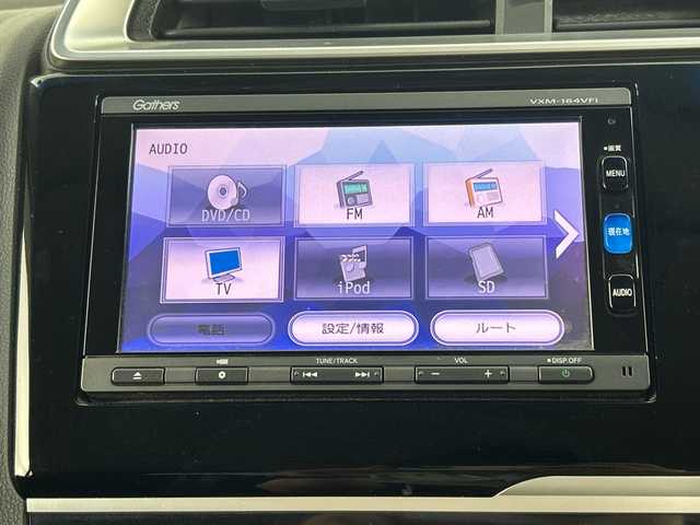 ホンダ フィット 13G Fパッケージ 愛知県 2016(平28)年 6.4万km プレミアムホワイトパールⅡ 禁煙車/純正7インチナビ/(CD/DVD/AM/FM/Bluetooth/ワンセグTV）/バックカメラ/ETC/前方ドライブレコーダー/スマートキー/プッシュスタート/純正フロアマット/横滑り防止装置/ステアリングスイッチ/オートエアコン/ドアバイザー