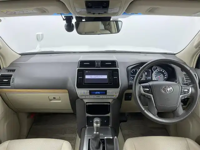 トヨタ ランドクルーザー プラド TX Lパッケージ 富山県 2023(令5)年 2.1万km ホワイトパールクリスタルシャイン サンルーフ/モデリスタエアロ/純正ナビ（AM/FM/DVD/BT/フルセグ）/バックカメラ/ドライブレコーダー/ETC/レザーシート/D/N席パワーシート/D/N席シートヒーター/D/N席シートベンチレーション/衝突被害軽減システム/レーダークルーズコントロール/レーンキープアシスト/コーナーセンサー/横滑り防止装置/純正アルミホイール/純正フロアマット/革巻きステアリング/ステアリングスイッチ/スマートキー