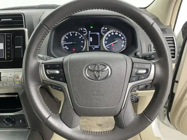 トヨタ ランドクルーザー プラド TX Lパッケージ 富山県 2023(令5)年 2.1万km ホワイトパールクリスタルシャイン サンルーフ/モデリスタエアロ/純正ナビ（AM/FM/DVD/BT/フルセグ）/バックカメラ/ドライブレコーダー/ETC/レザーシート/D/N席パワーシート/D/N席シートヒーター/D/N席シートベンチレーション/衝突被害軽減システム/レーダークルーズコントロール/レーンキープアシスト/コーナーセンサー/横滑り防止装置/純正アルミホイール/純正フロアマット/革巻きステアリング/ステアリングスイッチ/スマートキー