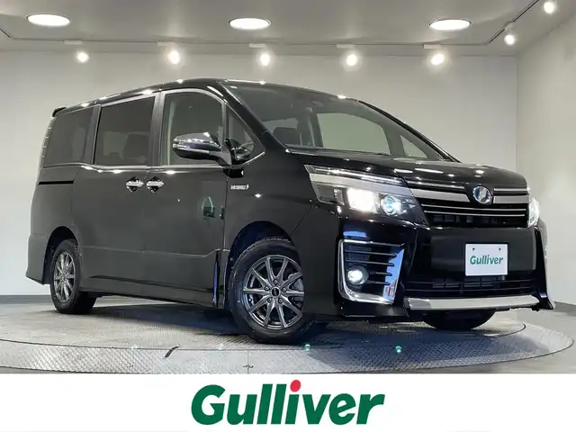 トヨタ ヴォクシー ハイブリッド ZS 煌Ⅱ 愛知県 2017(平29)年 8万km ブラック アルパインＢＩＧＸ１１インチ/アルパインフリップダウンモニター/ダブルゾーン/両側パワースライドドア/プリクラッシュセーフティ　/レーンディパーチャーアラート/先行車発進告知/オートハイビーム/アクセサリーソケット　/ビルトインＥＴＣ/バックカメラ/ISOFIX/プッシュスタート