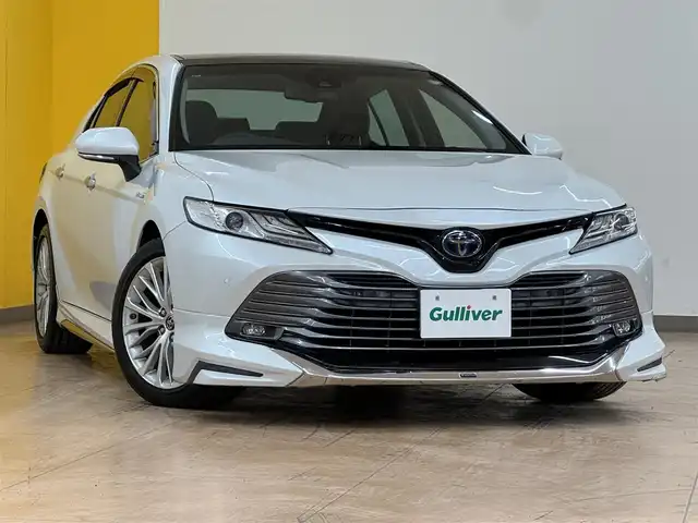 トヨタ カムリ G レザーパッケージ 群馬県 2017(平29)年 2.1万km プラチナホワイトパールマイカ トヨタセーフティセンス/プリクラッシュセーフティ/レーンディパーチャーアラート/レーダークルーズコントロール/オートマチックハイビーム/ブラインドスポットモニター/リアクロストラフィックアラート/ヘッドアップディスプレイ/クリアランスソナー/サンルーフ/メーカーオプションナビ/　フルセグ/BT/CD/DVD/SD/USB/AUX/レザーシート/モデリスタエアロ/前席シートヒーター/前席パワーシート/バックカメラ/純正18インチAW/純正フロアマット/LEDヘッドライト/フォグランプ/ビルトインETC2.0