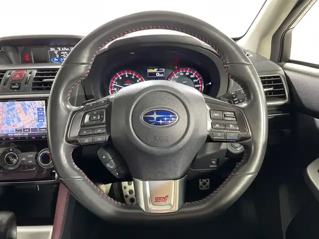 スバル レヴォーグ 1．6STIスポーツアイサイト 神奈川県 2017(平29)年 9.2万km クリスタルホワイトP 4WD/ターボ/純正7型メモリーナビゲーション【KXM-H701】/フルセグ　CD DVD　SD　Bluetooth　/サイド/バックカメラ/アイサイトver３/ブラインドスポットモニター/プリクラッシュブレーキ/アクティブレーンキープ/全車速追従機能付クルーズコントロール/AT誤発進抑制機能/後退時ブレーキアシスト/車線逸脱警報機能/アイドリングストップ/ダウンヒルアシストコントロール/革シート/前席シートヒーター/パワーシート/運転席ポジションメモリー/革巻きステアリング/パドルシフト/ステアリングスイッチ/パドルシフト/前方ドライブレコーダー/社外ETC/電動パーキングブレーキ/プッシュスタート/スマートキー/LEDヘッドランプ/オートハイビーム/フロントフォグランプ/オートライト/純正18インチアルミホイール/純正リアスポイラー/電格ウインカーミラー/スペアキー