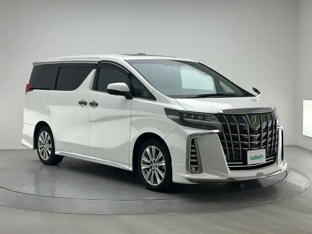 トヨタ アルファード S タイプゴールド 兵庫県 2021(令3)年 3.2万km ホワイトパールクリスタルシャイン 純正メモリナビ/（CD/DVD/Bluetooth/Miracast/フルセグTV）/バックカメラ/純正ディスプレイオーディオ/サンルーフ/コーナーセンサー（前後）/アダクティブクルーズコントロール/レーンディパーチャーアラート/レーンキープアシスト/プリクラッシュセーフティー/ブラインドスポットモニター/横滑り防止装置/盗難防止装置/カーテンエアバッグ/デジタルインナーミラー/純正フリップダウンモニター/両側パワースライドドア/パワーバックドア/ハーフレザーシート/LEDヘッドライト/LEDフォグランプ/オートライト/オートマチックハイビーム/ビルトインETC/社外ウィンカーミラー/MODELLISTAスポイラー（フロント/リア）/ウォークスルー/前方ドライブレコーダー/純正18インチアルミホイール/純正フロアマット/ドアバイザー/スマートキー