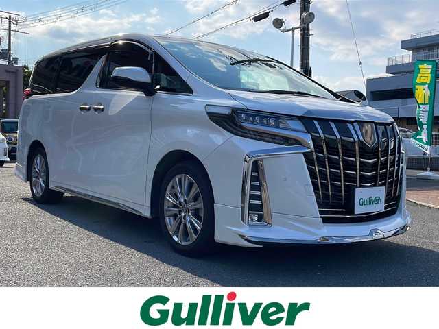 トヨタ アルファード S タイプゴールド 大阪府 2021(令3)年 3.2万km ホワイトパールクリスタルシャイン 純正メモリナビ/（CD/DVD/Bluetooth/Miracast/フルセグTV）/純正フリップダウンモニター/バックカメラ/サンルーフ/コーナーセンサー（前後）/アダクティブクルーズコントロール/レーンディパーチャーアラート/レーンキープアシスト/プリクラッシュセーフティー/ブラインドスポットモニター/横滑り防止装置/盗難防止装置/カーテンエアバッグ/デジタルインナーミラー/両側パワースライドドア/パワーバックドア/ハーフレザーシート/LEDヘッドライト/LEDフォグランプ/オートライト/オートマチックハイビーム/ビルトインETC/社外ウィンカーミラー/MODELLISTAスポイラー（フロント/リア）/ウォークスルー/前方ドライブレコーダー/純正18インチアルミホイール/純正フロアマット/ドアバイザー/プッシュスタート