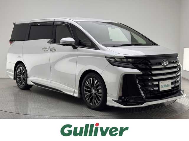 トヨタ ヴェルファイア Z プレミア 兵庫県 2024(令6)年 1.9万km プラチナホワイトパールマイカ 両側パワースライドドア/パワーバックドア/ドラレコ/純正メモリナビ/（BT、USB、Miracast、フルセグ）/純正DA/HDMI/アラウンドビューモニター/パーキングアシスト/コーナーセンサー/パドルシフト/LDA/ACC/TCS/BSM/PCS/HUD/前席、2ndシートパワーシート/前席、2ndシートシートヒーター/前席、2ndシートベンチレーション/ステアリングヒーター/F・S・RGRスポイラー/AWD/オートハイビーム/LEDヘッドライト/ビルトインETC2.0/デジタルインナーミラー/茶レザーシート/ワイヤレス充電/スーパーロングオーバーヘッドコンソール/左右独立ムーンルーフ/純正19インチAW/社外マット、バイザー/スペアキー1本