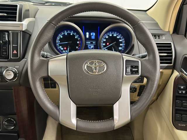 トヨタ ランドクルーザー プラド TX Lパッケージ 道央・札幌 2015(平27)年 12.7万km ホワイトパールクリスタルシャイン ワンオーナー/純正SDナビ/DVD　CD DTV　BT　ラジオ　/バックカメラ/ビルトインETC/寒冷地仕様/レザーシート/シートヒーター/モデリスタエアロ/クルーズコントロール/フロアマット/ドアバイザー