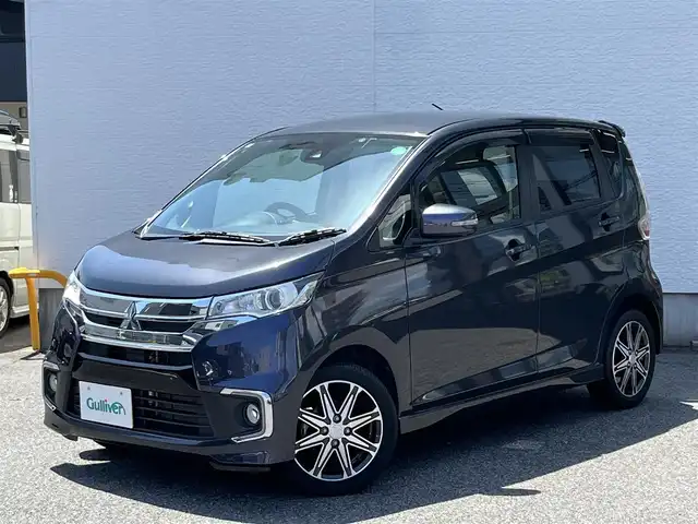 三菱 ｅＫカスタム Tセーフティプラスエディション 愛知県 2019(平31)年 7万km パープリッシュネイビーパール /禁煙車//純正ディーラーメモリナビ・フルセグTV/（MM318D-WM）/CD・DVD・Bluetooth・AM・FM・AUX//バックカメラ//マルチアラウンドモニター//衝突被害軽減ブレーキ//クルーズコントロール//アクティブスタビリティコントロール（ASC）//車線逸脱警報システム（LDW）//HIDヘッドライト・オートライト//オートマチックハイビーム（AHB）//フロントフォグランプ//クリアランスソナー//プッシュスタート//運転席シートヒーター//ETC//革巻きステアリング//ステアリングスイッチ//電動格納ミラーウインカー//純正ドアバイザー//衝突安全ボディ//取扱説明書