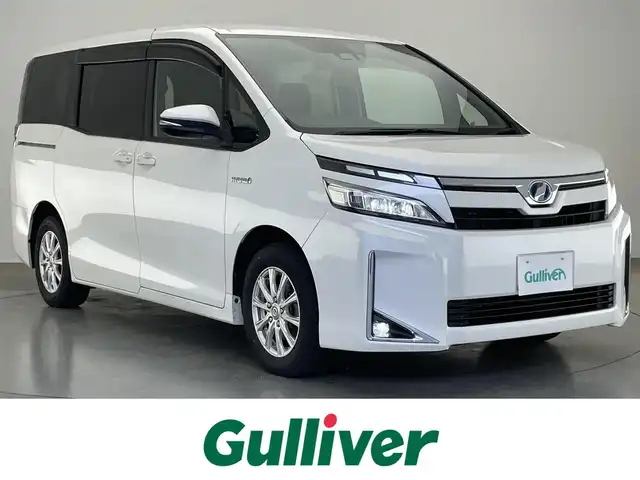 トヨタ ヴォクシー ハイブリッド V 愛知県 2018(平30)年 7.5万km ホワイトパールクリスタルシャイン 純正９型ナビ　フルセグＴＶ　Ｂｌｕｅｔｏｏｔｈ　シートヒーター　両側パワースライドドア　クルーズコントロール　セーフティセンス　衝突軽減　車線逸脱　ＬＥＤオートライト　ドラレコ　バックカメラ　禁煙車