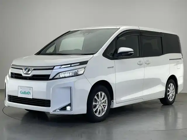 トヨタ ヴォクシー ハイブリッド V 愛知県 2018(平30)年 7.5万km ホワイトパールクリスタルシャイン 純正９型ナビ　フルセグＴＶ　Ｂｌｕｅｔｏｏｔｈ　シートヒーター　両側パワースライドドア　クルーズコントロール　セーフティセンス　衝突軽減　車線逸脱　ＬＥＤオートライト　ドラレコ　バックカメラ　禁煙車