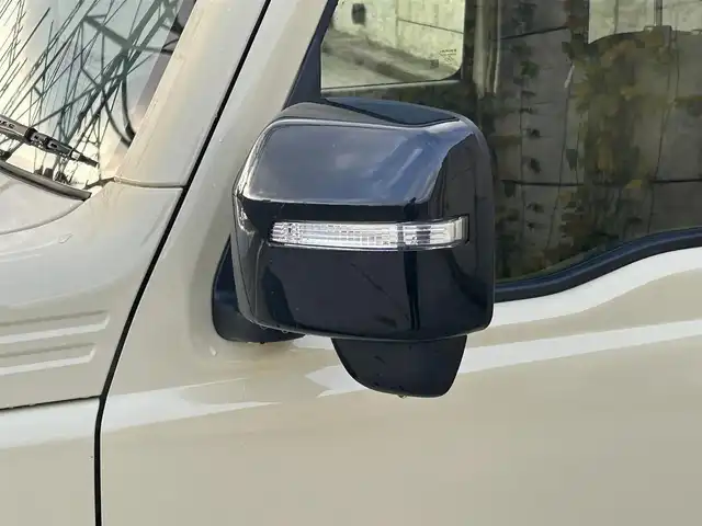 スズキ ジムニー ノマド FC 長崎県 2025(令7)年 0.3万km ベージュⅡ ワンオーナー/衝突軽減システム/レーンアシスト/レーダークルーズ/シートヒーター/スマートキー/プッシュスタート/電動格納ミラー/アイドリングストップ/純正15インチAW