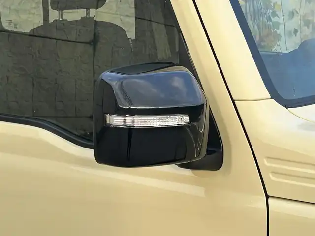 スズキ ジムニー ノマド FC 長崎県 2025(令7)年 0.3万km ベージュⅡ ワンオーナー/衝突軽減システム/レーンアシスト/レーダークルーズ/シートヒーター/スマートキー/プッシュスタート/電動格納ミラー/アイドリングストップ/純正15インチAW