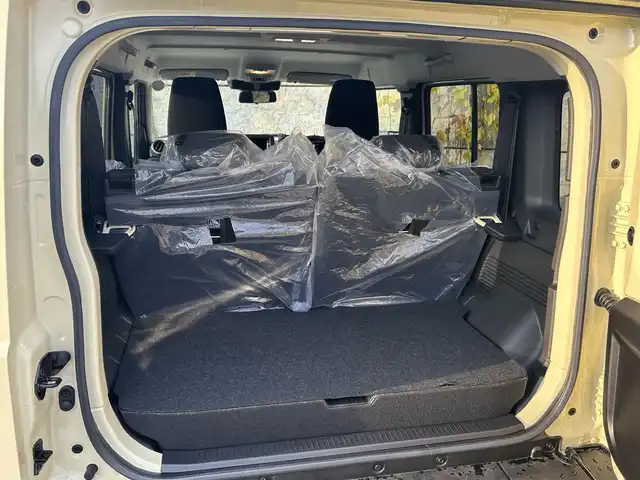 スズキ ジムニー ノマド FC 長崎県 2025(令7)年 0.3万km ベージュⅡ ワンオーナー/衝突軽減システム/レーンアシスト/レーダークルーズ/シートヒーター/スマートキー/プッシュスタート/電動格納ミラー/アイドリングストップ/純正15インチAW