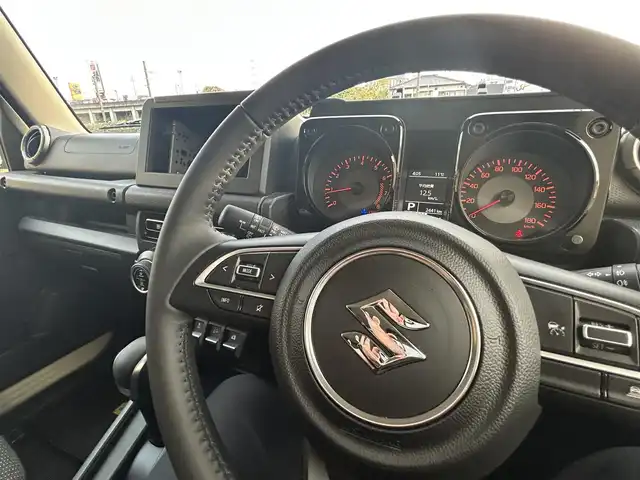 スズキ ジムニー ノマド FC 長崎県 2025(令7)年 0.3万km ベージュⅡ ワンオーナー/衝突軽減システム/レーンアシスト/レーダークルーズ/シートヒーター/スマートキー/プッシュスタート/電動格納ミラー/アイドリングストップ/純正15インチAW