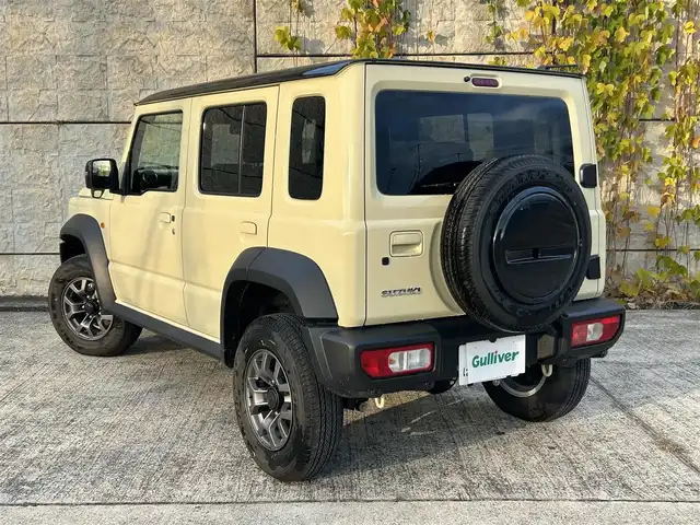 スズキ ジムニー ノマド FC 長崎県 2025(令7)年 0.3万km ベージュⅡ ワンオーナー/衝突軽減システム/レーンアシスト/レーダークルーズ/シートヒーター/スマートキー/プッシュスタート/電動格納ミラー/アイドリングストップ/純正15インチAW