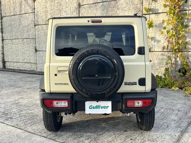 スズキ ジムニー ノマド FC 長崎県 2025(令7)年 0.3万km ベージュⅡ ワンオーナー/衝突軽減システム/レーンアシスト/レーダークルーズ/シートヒーター/スマートキー/プッシュスタート/電動格納ミラー/アイドリングストップ/純正15インチAW