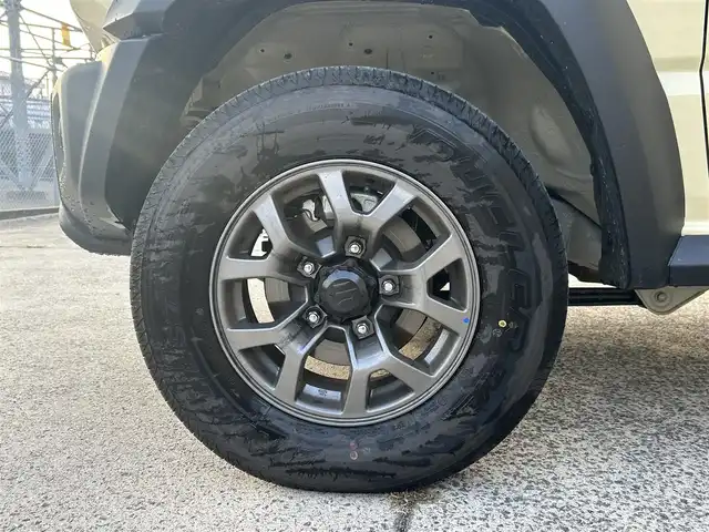 スズキ ジムニー ノマド FC 長崎県 2025(令7)年 0.3万km ベージュⅡ ワンオーナー/衝突軽減システム/レーンアシスト/レーダークルーズ/シートヒーター/スマートキー/プッシュスタート/電動格納ミラー/アイドリングストップ/純正15インチAW