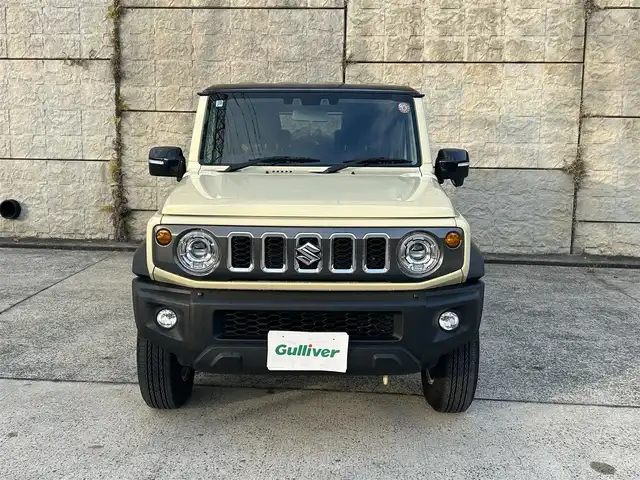 スズキ ジムニー ノマド FC 長崎県 2025(令7)年 0.3万km ベージュⅡ ワンオーナー/衝突軽減システム/レーンアシスト/レーダークルーズ/シートヒーター/スマートキー/プッシュスタート/電動格納ミラー/アイドリングストップ/純正15インチAW