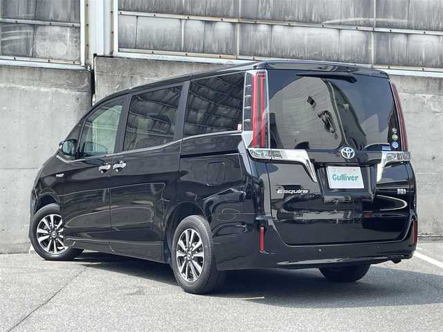 トヨタ エスクァイア ハイブリッド Gi 愛知県 2020(令2)年 8.5万km ブラック ワンオーナー/スペアタイヤ/レザーシート(合皮)/純正SDナビ/フルセグTV・Bluetooth・AM・FM・CD・DVD・SD/バックカメラ/純正後席用フリップダウンモニター/前席シートヒーター/プリクラッシュセーフティ/レーンディパーチャーアラート/クルーズコントロール/クリアランスソナー/LEDヘッドライト/フォグランプ/オートライト/ビルトインETC/ステアリングスイッチ/純正フロアマット/USB2ポート/二列目サンシェード/保証書/点検整備記録簿(R5/R6)