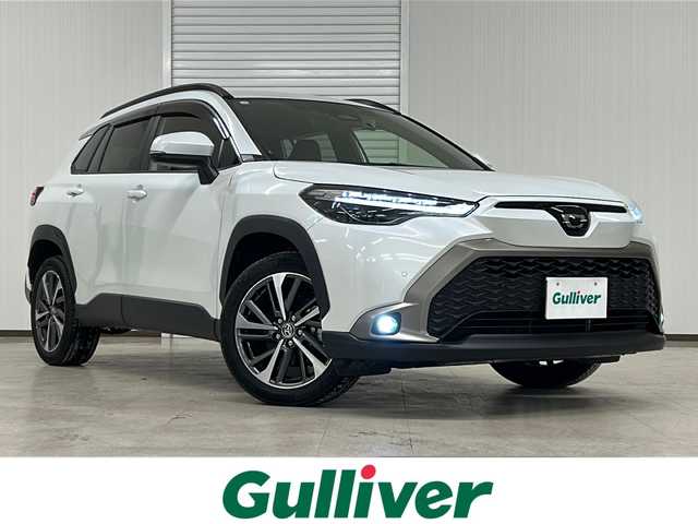 トヨタ カローラ クロス ハイブリッド Z 熊本県 2023(令5)年 1.7万km プラチナホワイトパールマイカ 純正ディスプレイオーディオ/（ラジオ/フルセグ/ＢＴ/Applecarplay)/バックカメラ/ＥＴＣ/前後ドライブレコーダー/レーダークルーズコントロール/パワーバックドア/パワーシート/Ｄ・Ｎ席シートヒーター/ステアリングスイッチ/ハーフレザーシート/オートライト/オートハイビーム/フォグランプ/レーンキープアシスト/衝突軽減システム/横滑り防止装置/ブラインドスポットモニター/前後コーナーセンサー/スマートキー×２/純正フロアマット/純正18インチＡＷ/電動パーキングブレーキ（オートホールド付き）/プッシュスタート/ドアバイザー/ルーフレール