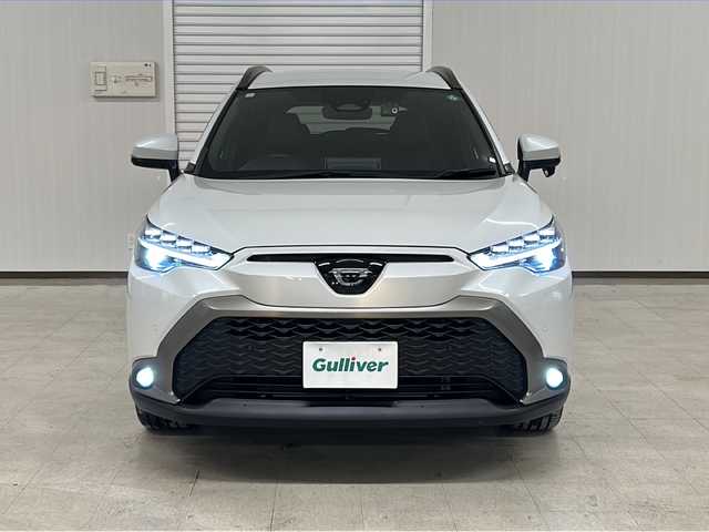 トヨタ カローラ クロス ハイブリッド Z 熊本県 2023(令5)年 1.7万km プラチナホワイトパールマイカ 純正ディスプレイオーディオ/（ラジオ/フルセグ/ＢＴ/Applecarplay)/バックカメラ/ＥＴＣ/前後ドライブレコーダー/レーダークルーズコントロール/パワーバックドア/パワーシート/Ｄ・Ｎ席シートヒーター/ステアリングスイッチ/ハーフレザーシート/オートライト/オートハイビーム/フォグランプ/レーンキープアシスト/衝突軽減システム/横滑り防止装置/ブラインドスポットモニター/前後コーナーセンサー/スマートキー×２/純正フロアマット/純正18インチＡＷ/電動パーキングブレーキ（オートホールド付き）/プッシュスタート/ドアバイザー/ルーフレール