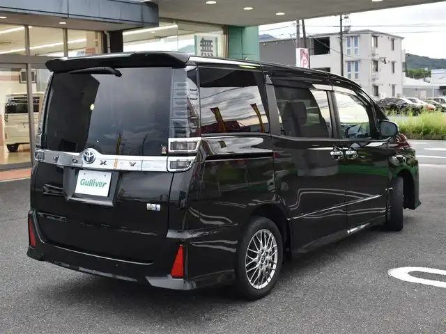 トヨタ ヴォクシー ハイブリッド ZS 煌Ⅲ 福岡県 2021(令3)年 4.6万km イナズマスパーキングブラックガラスフレーク トヨタセーフティセンス/純正9インチメモリーナビ/純正後席フリップダウンモニター/フルセグTV/CD/DVD/BT/バックカメラ/純正前後ドライブレコーダー/純正LEDヘッドライト/純正16インチアルミホイール/両側パワースライドドア/クルーズコントロール/ハーフレザーシート/前席シートヒーター/クリアランスソナー/ビルトインETC/プッシュスタート/スマートキー×2/新車時保証所/取扱説明書